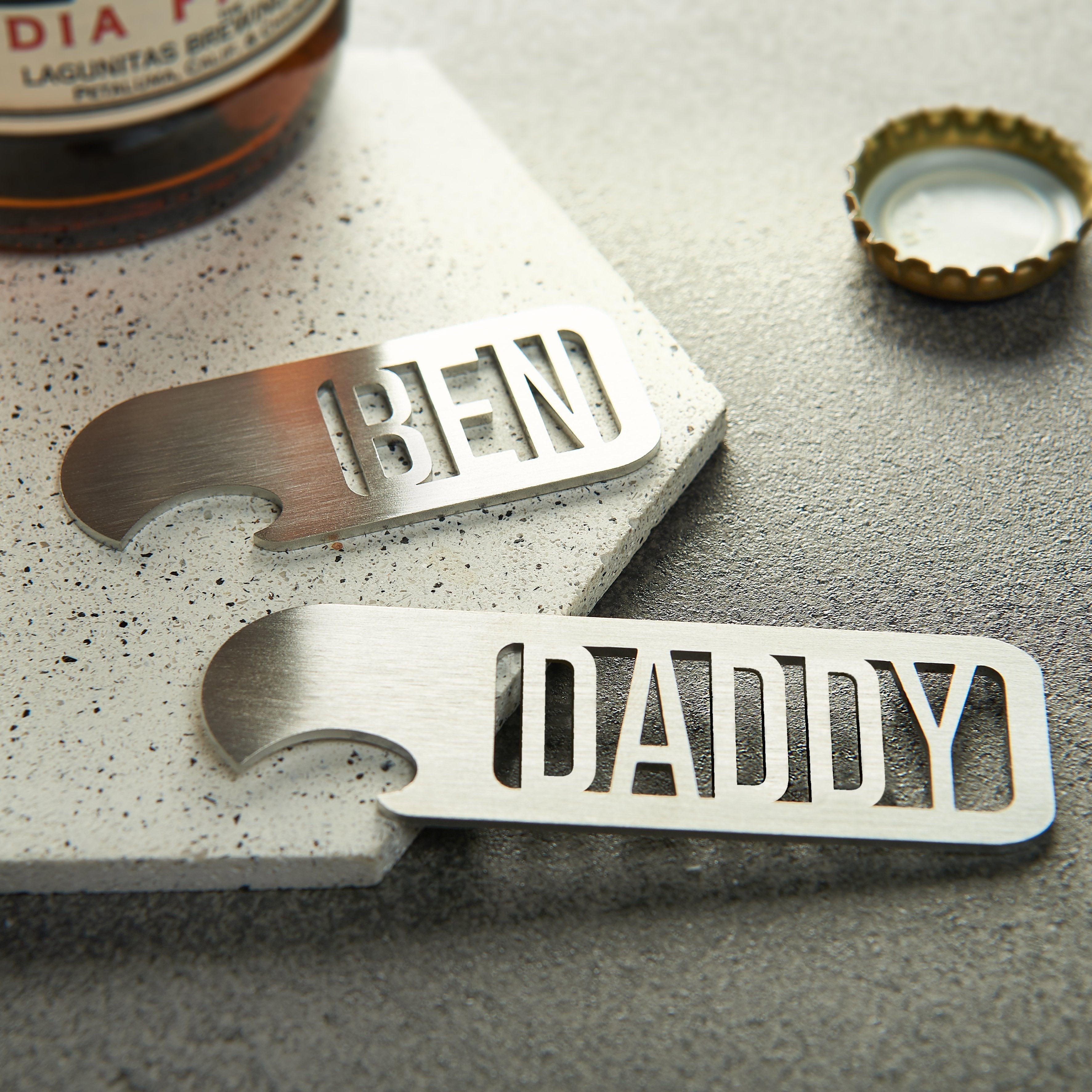 stainless steel personalised name bottle opener with the name daddy